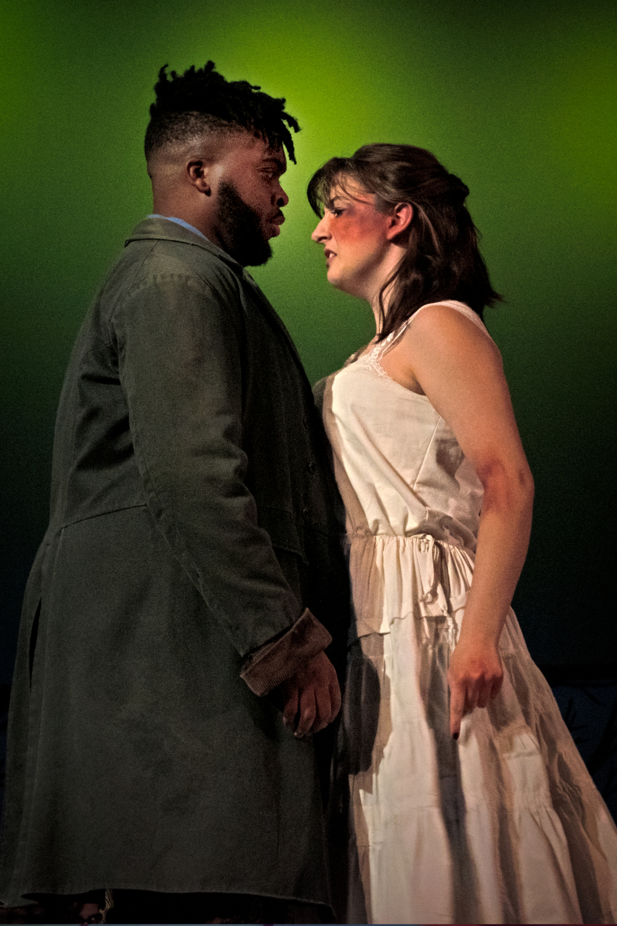 Image of two people facing each other from Crucible