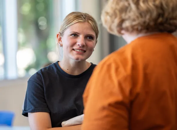 Student talking with a professor