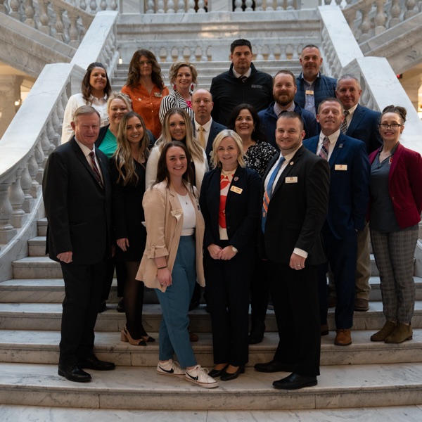 Snow College staff, faculty, and others pose on the steps of the rotunda