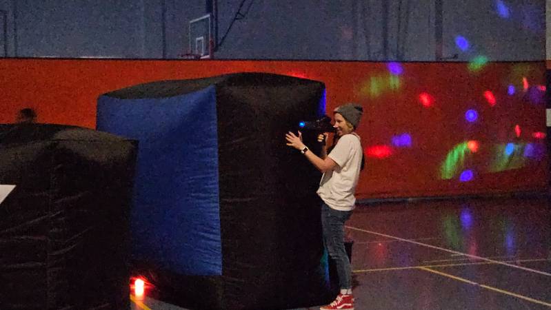 Laser Tag with blow up obstacles in the blue gym at Snow College